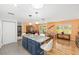 Kitchen boasts granite countertops and a blue island with bar seating that opens to the living area at 9069 Sw 96Th Ln # B, Ocala, FL 34481