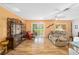 Spacious living room with laminate flooring, a tan sofa, and sliding doors to the patio at 9069 Sw 96Th Ln # B, Ocala, FL 34481