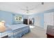 Bright main bedroom boasts a ceiling fan, natural light and an en suite bathroom at 9069 Sw 96Th Ln # B, Ocala, FL 34481