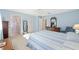Bright main bedroom boasts a ceiling fan, natural light, a large closet and an en suite bathroom at 9069 Sw 96Th Ln # B, Ocala, FL 34481