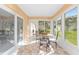 Sunroom with tile floors, lots of windows, and direct access to the outdoors at 9069 Sw 96Th Ln # B, Ocala, FL 34481