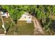 An aerial view of a cute, well-maintained home with a grass yard at 935 Ne Sanchez Ave, Ocala, FL 34470