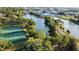Aerial view of a park with a lake, tennis courts, and walking trails at 935 Ne Sanchez Ave, Ocala, FL 34470