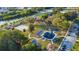 Aerial view of a park with a playground, courts, and parking area at 935 Ne Sanchez Ave, Ocala, FL 34470