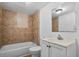 This bathroom features tile surround, a toilet, and a vanity at 935 Ne Sanchez Ave, Ocala, FL 34470