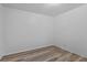 This bedroom features neutral walls and wood-look flooring at 935 Ne Sanchez Ave, Ocala, FL 34470