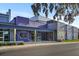 Reilly Arts Center exterior showcasing modern architecture, ticket booth and artful mural, enhancing community appeal at 935 Ne Sanchez Ave, Ocala, FL 34470