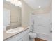 Bathroom featuring shower-tub combo and vanity with granite countertop at 9541 Sw 93Rd Loop, Ocala, FL 34481