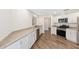 Modern kitchen featuring stainless appliances, granite counters, and white cabinets at 9541 Sw 93Rd Loop, Ocala, FL 34481