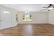 Spacious living room with laminate floors, a ceiling fan, and neutral wall color at 9541 Sw 93Rd Loop, Ocala, FL 34481