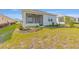 Beautiful backyard showcasing a screened patio and lush green grass at 9697 Sw 102Nd Ter, Ocala, FL 34481