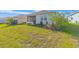 Well-maintained backyard with a vibrant green lawn, plantings, and a screened patio at 9697 Sw 102Nd Ter, Ocala, FL 34481