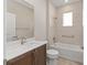Bathroom with a single sink, bathtub and shower combo, and tile flooring at 9697 Sw 102Nd Ter, Ocala, FL 34481