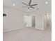 Spacious bedroom with an open doorway and attached bathroom offers ample space and convenience at 9697 Sw 102Nd Ter, Ocala, FL 34481