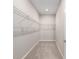 Walk-in closet with built-in wire shelving for organizing clothes and accessories at 9697 Sw 102Nd Ter, Ocala, FL 34481