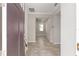 Bright entryway featuring neutral paint, tiled floors, and a view to the living spaces at 9697 Sw 102Nd Ter, Ocala, FL 34481