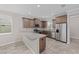 Bright kitchen with stainless steel appliances, granite countertops, and ample cabinet space at 9697 Sw 102Nd Ter, Ocala, FL 34481