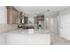 Modern kitchen featuring granite countertops, stainless steel appliances and wood cabinets at 9697 Sw 102Nd Ter, Ocala, FL 34481