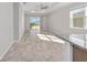 Bright living area with tile flooring, sliding glass doors, and view of the backyard at 9697 Sw 102Nd Ter, Ocala, FL 34481