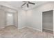 Open-concept living room featuring neutral walls, tiled flooring, and an entrance to a walk-in closet at 9697 Sw 102Nd Ter, Ocala, FL 34481