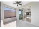 Covered patio with sliding glass doors looking into the kitchen and a scenic backyard view at 9697 Sw 102Nd Ter, Ocala, FL 34481