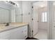 Bathroom with white cabinets, sink, and a view of the doorway to the shower at 10141 Sw 62Nd Terrace Rd, Ocala, FL 34476