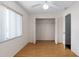 Bedroom featuring hardwood floors, ceiling fan and opened closet at 10141 Sw 62Nd Terrace Rd, Ocala, FL 34476