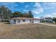Charming home featuring a two-car garage and well-kept lawn in daylight at 10141 Sw 62Nd Terrace Rd, Ocala, FL 34476