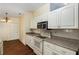 Kitchen with white cabinets, stainless microwave and stove, and recessed lighting overhead at 10141 Sw 62Nd Terrace Rd, Ocala, FL 34476