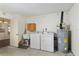 This laundry room features a utility sink, a washer and dryer, and a newer hot water heater at 10141 Sw 62Nd Terrace Rd, Ocala, FL 34476