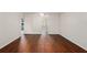 Spacious living room with a ceiling fan and laminate wood flooring at 10141 Sw 62Nd Terrace Rd, Ocala, FL 34476