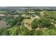 Expansive aerial view shows the property, with mature trees and surrounding landscape at 10575 Sw 27Th Ave, Ocala, FL 34476