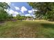 Lush backyard showing the home and surrounding landscaping at 10575 Sw 27Th Ave, Ocala, FL 34476