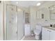 Clean bathroom offers a glass door shower, vanity with sink, and ample storage at 10575 Sw 27Th Ave, Ocala, FL 34476