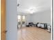 Bright bedroom features wood floors, a ceiling fan, and a large window at 10575 Sw 27Th Ave, Ocala, FL 34476