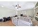 Spacious bedroom features hardwood floors, ceiling fan, and a neutral color palette at 10575 Sw 27Th Ave, Ocala, FL 34476