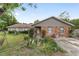 Charming single-story home with a stone facade and a well-manicured front yard at 10575 Sw 27Th Ave, Ocala, FL 34476