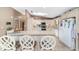 Lovely kitchen with white cabinetry, a skylight, tile flooring and a center island at 10575 Sw 27Th Ave, Ocala, FL 34476