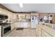 Bright kitchen with white cabinets, stainless steel appliances, and tile flooring at 10575 Sw 27Th Ave, Ocala, FL 34476
