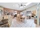 Open-concept kitchen flowing into a dining area, featuring tile flooring and natural light at 10575 Sw 27Th Ave, Ocala, FL 34476