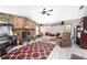 Bright living room features a stone fireplace and comfortable seating at 10575 Sw 27Th Ave, Ocala, FL 34476