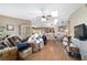 Open living room area featuring wood flooring, and lots of windows at 10575 Sw 27Th Ave, Ocala, FL 34476