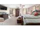 Spacious main bedroom with a king bed, armoire, and lots of natural light at 10575 Sw 27Th Ave, Ocala, FL 34476