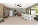 Covered patio with tile floors, outdoor kitchen, and ample seating at 10575 Sw 27Th Ave, Ocala, FL 34476