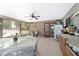 Relaxing screened porch with stone wall and outdoor dining area at 10575 Sw 27Th Ave, Ocala, FL 34476
