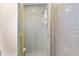 Clean and modern shower with patterned walls, featuring a shower head and adjustable handle at 10575 Sw 27Th Ave, Ocala, FL 34476