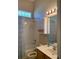 Clean bathroom featuring a bathtub, vanity with sink, and a mirror, providing functionality at 10918 Sw 71St Cir, Ocala, FL 34476