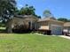 Charming single story home featuring mature landscaping and a two-car garage at 10918 Sw 71St Cir, Ocala, FL 34476