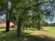 A scenic view of the golf course with mature trees, adjacent to the property at 10918 Sw 71St Cir, Ocala, FL 34476