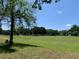 Picturesque view of the lush green golf course, surrounded by mature trees at 10918 Sw 71St Cir, Ocala, FL 34476